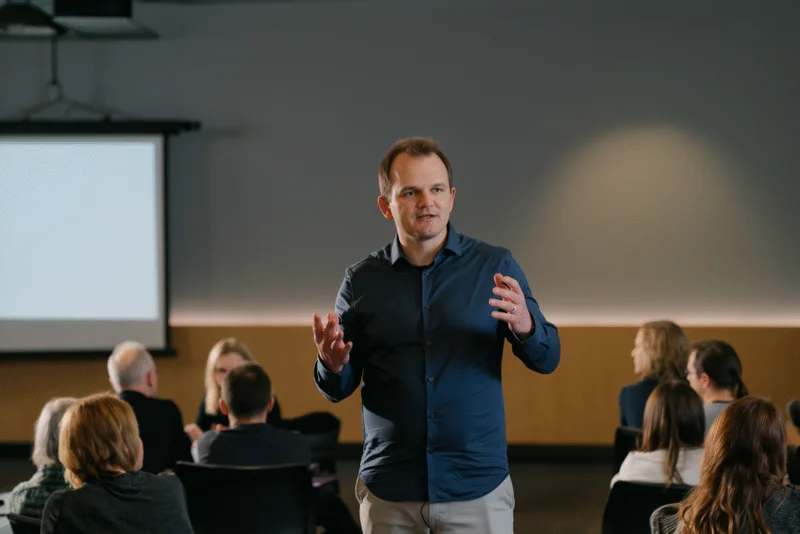 Speaker presenting at age:AI event